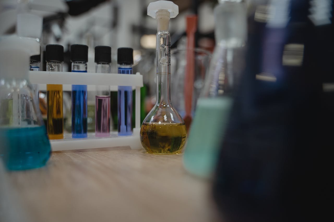 Vibrant laboratory setup with test tubes and flasks filled with colored liquids.